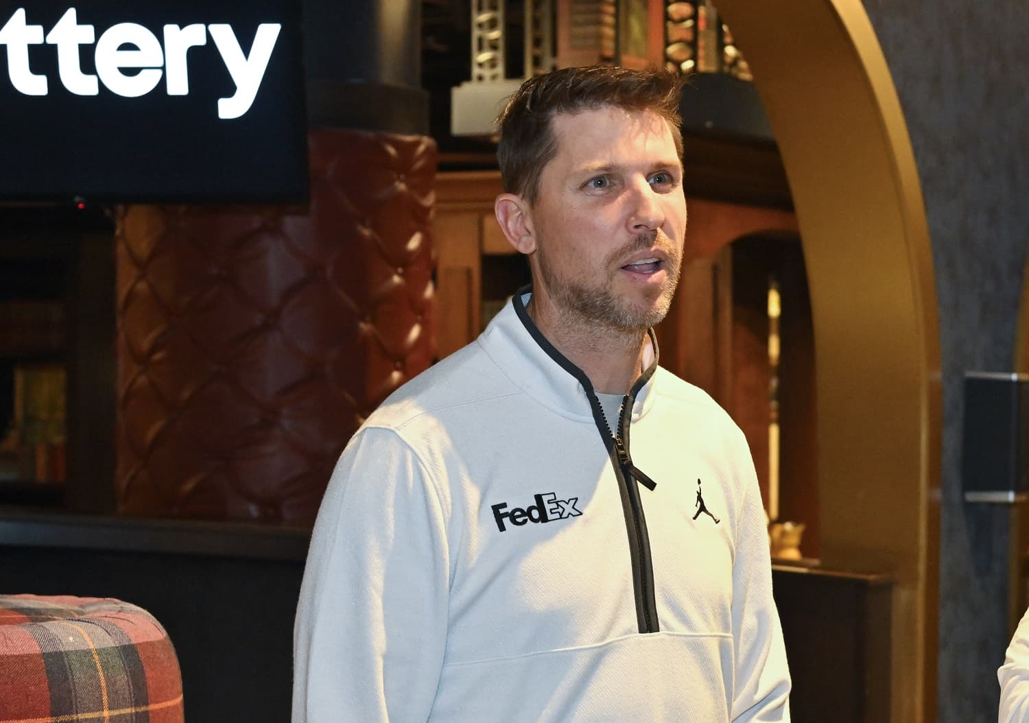 NASCAR driver Denny Hamlin during an appearance with PGA Tour star Rory McIlroy on May 2, 2023 in Charlotte, North Carolina.