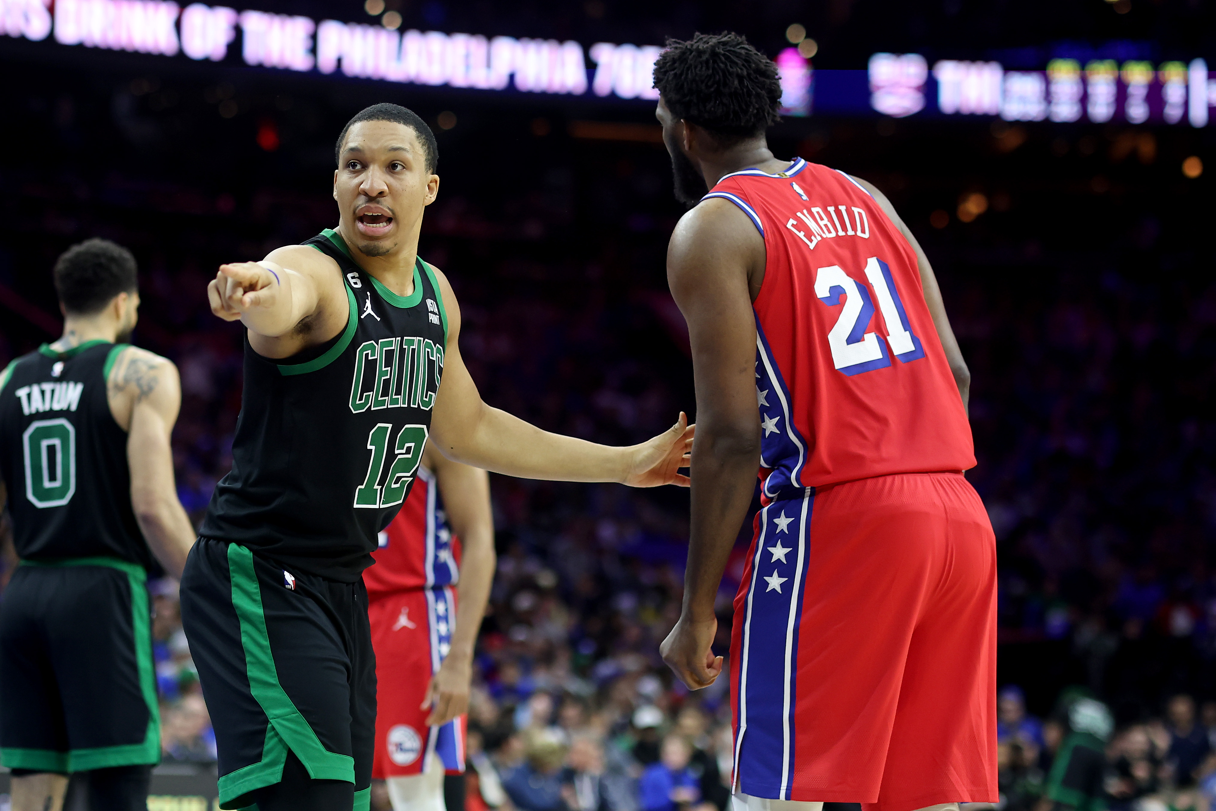 Grant Williams of the Boston Celtics points against Joel Embiid of the Philadelphia 76ers.
