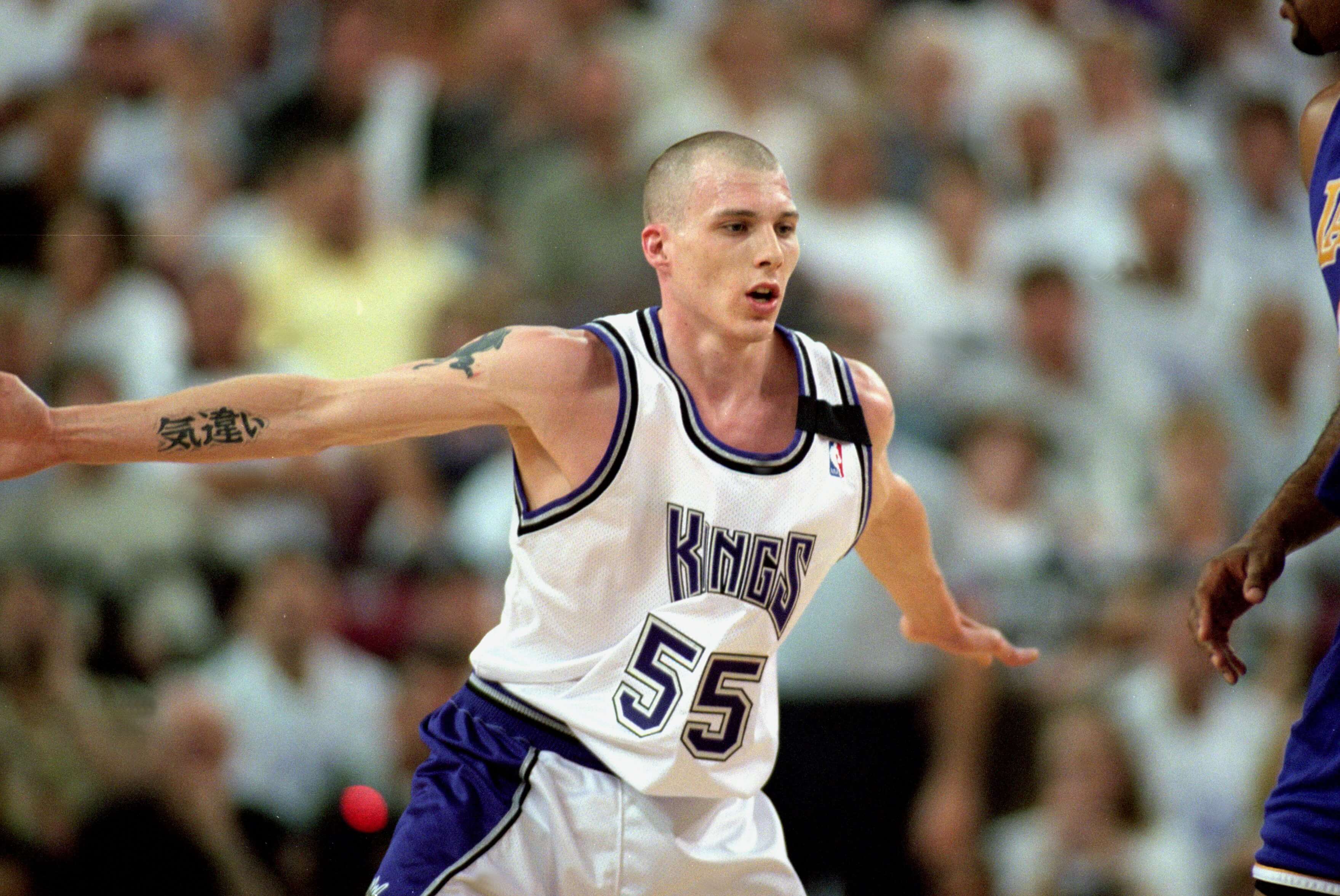 Jason Williams of the Sacramento Kings watches the action.