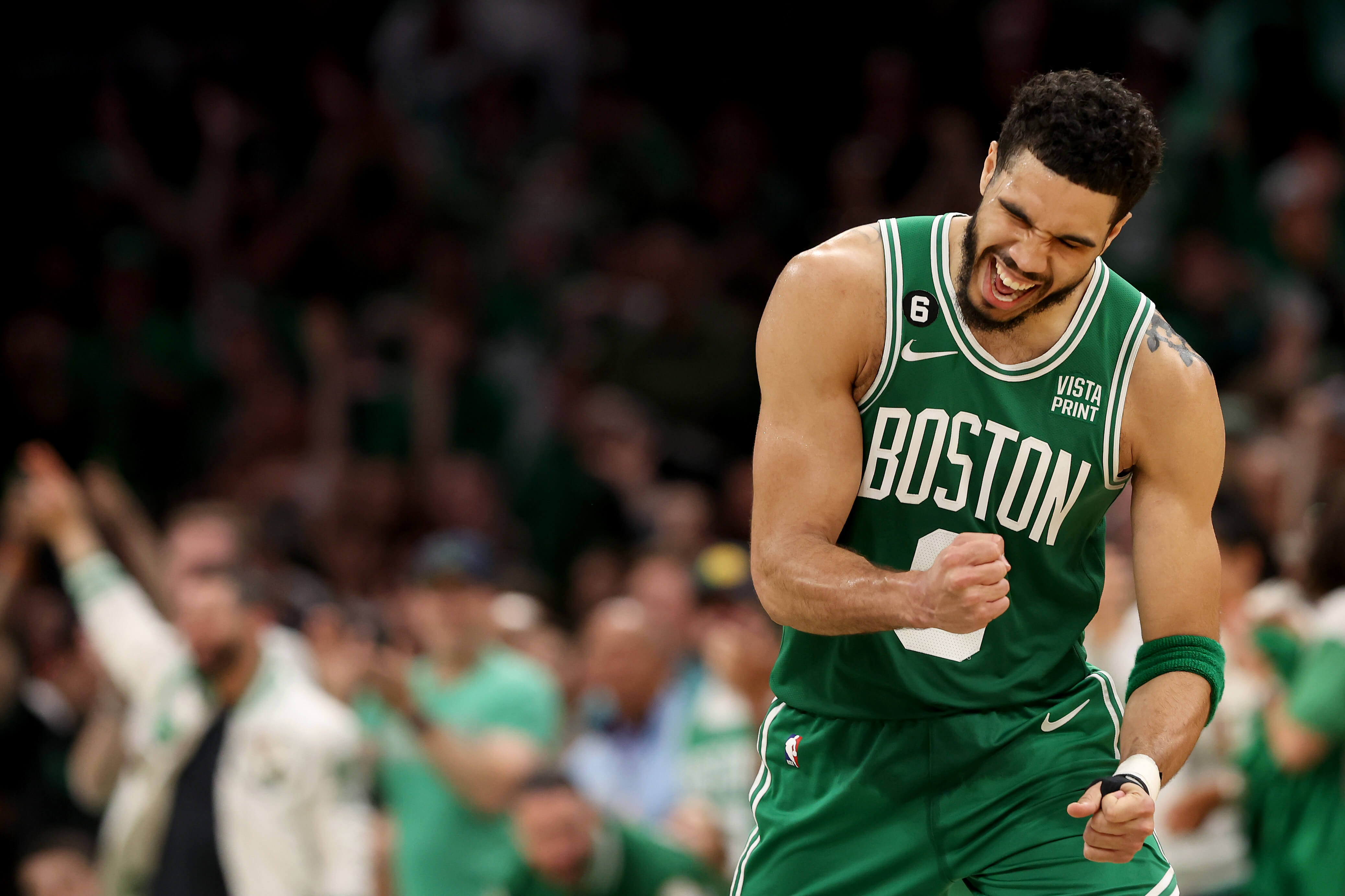 Jayson Tatum of the Boston Celtics celebrates a basket.