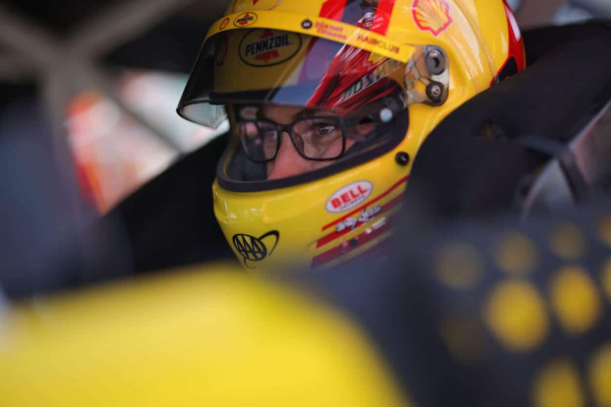 Joey Logano in his car at Kansas.