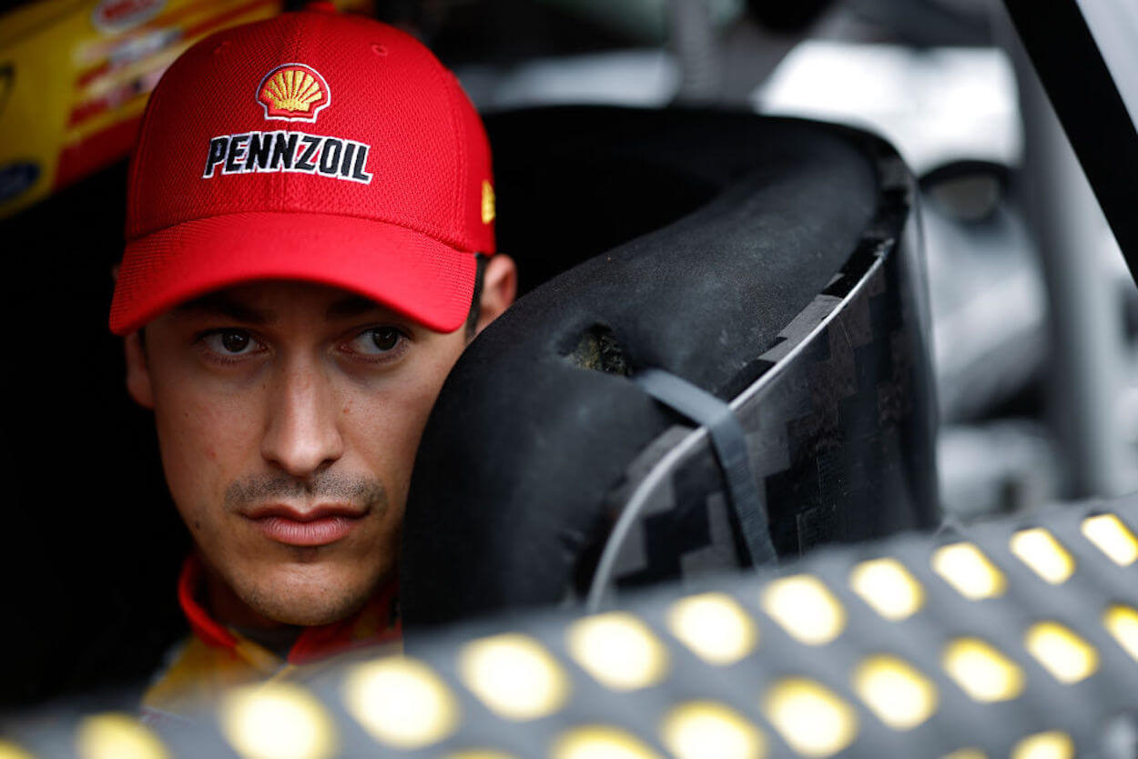 Joey Logano sits in his car at the NASCAR All-Star Race.