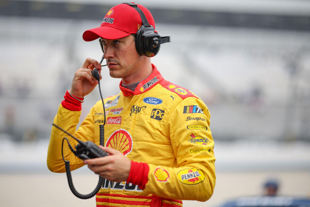 Joey Logano prepares for practice at Dover.