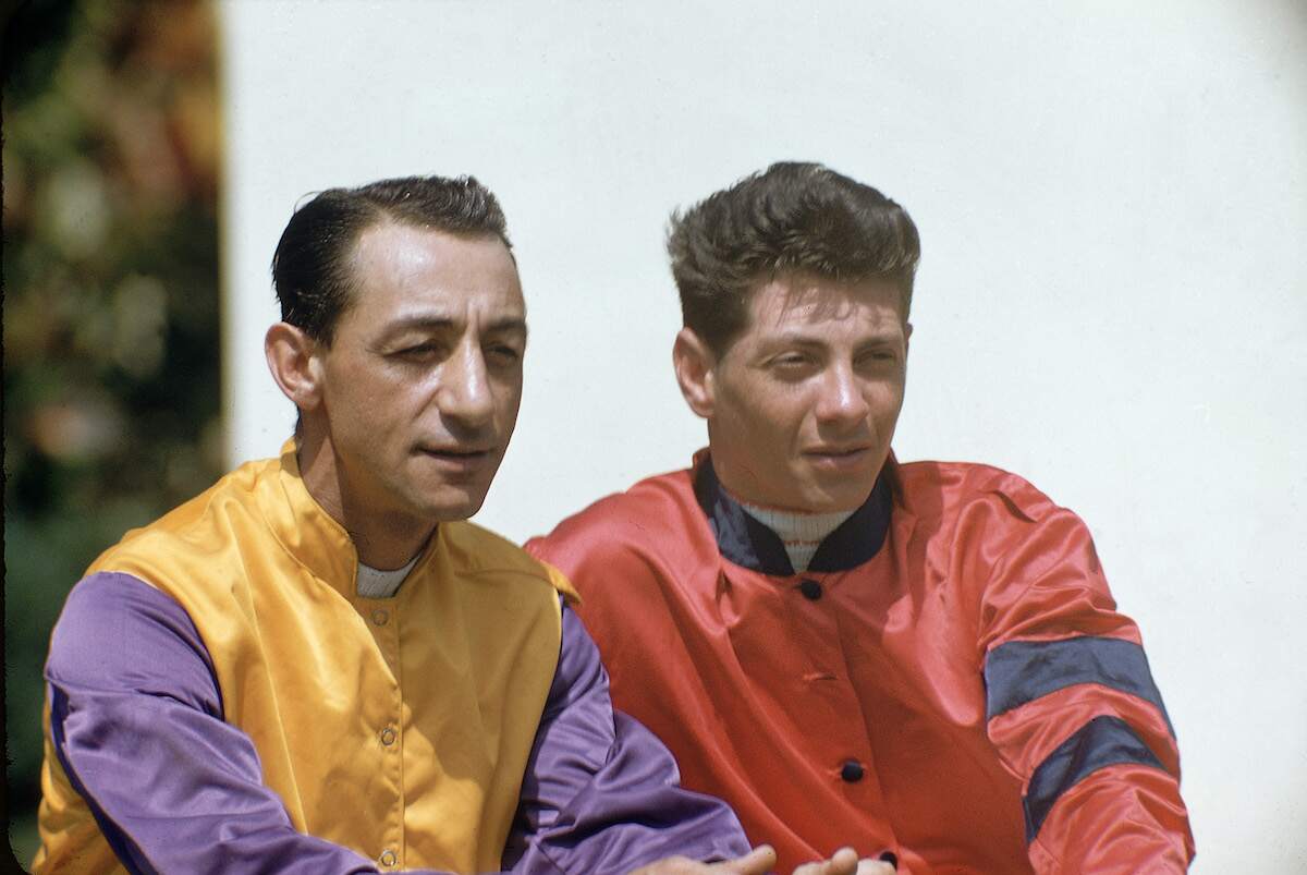 Thoroughbred horse racing jockeys Eddie Arcaro and Bill Hartack wear in their racing silks in the late '50s or early '60s