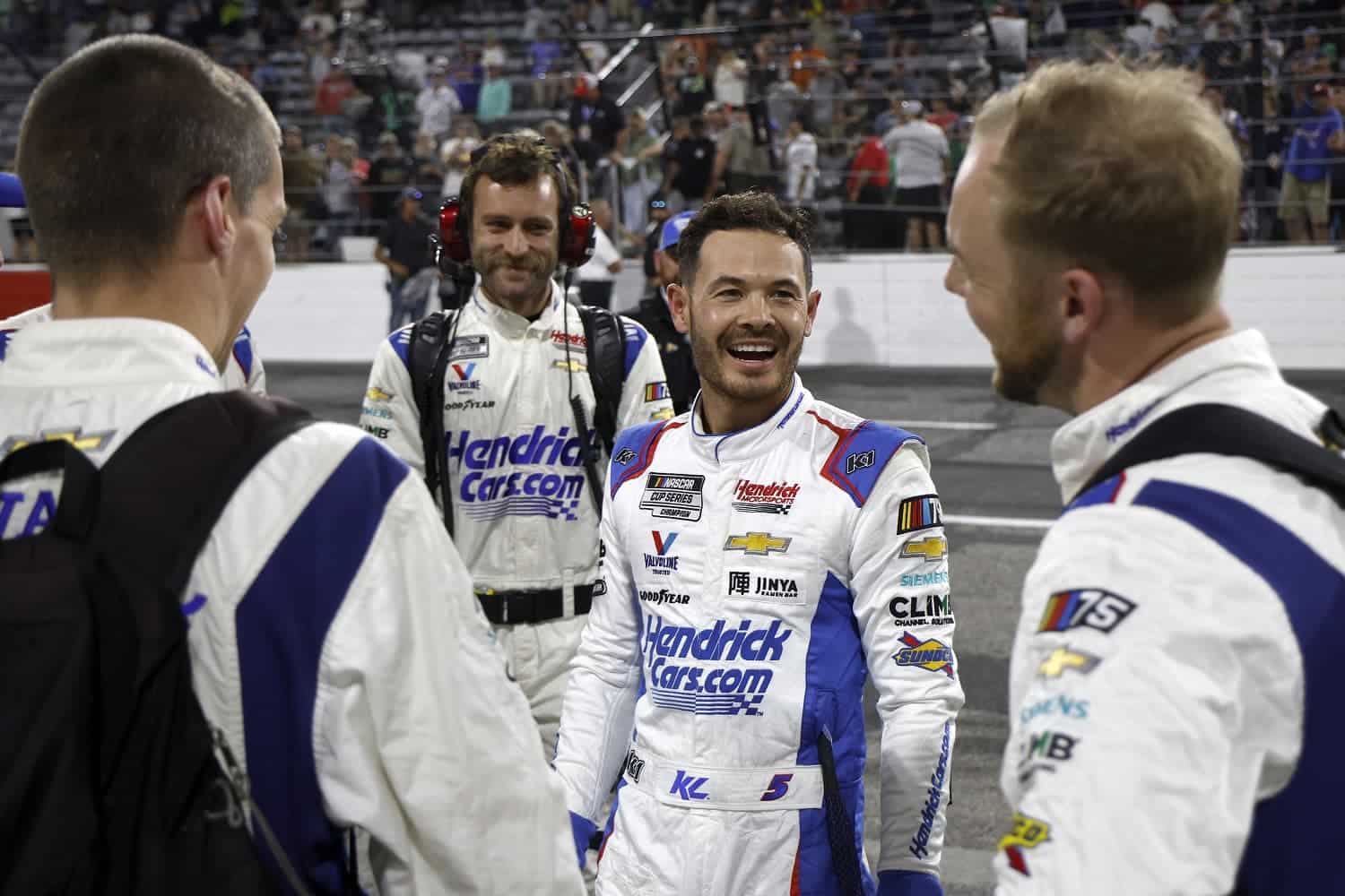 Kyle Larson and crew celebrate after winning the NASCAR Cup Series All-Star Race at North Wilkesboro Speedway on May 21, 2023.