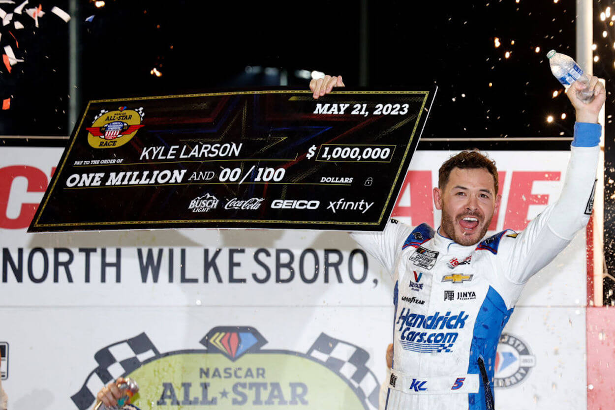 Kyle Larson celebrates winning the NASCAR All-Star Race.