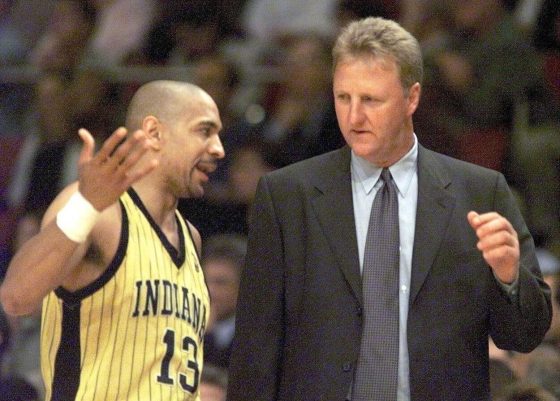 Larry Bird (R) and Mark Jackson (L) during an NBA game.