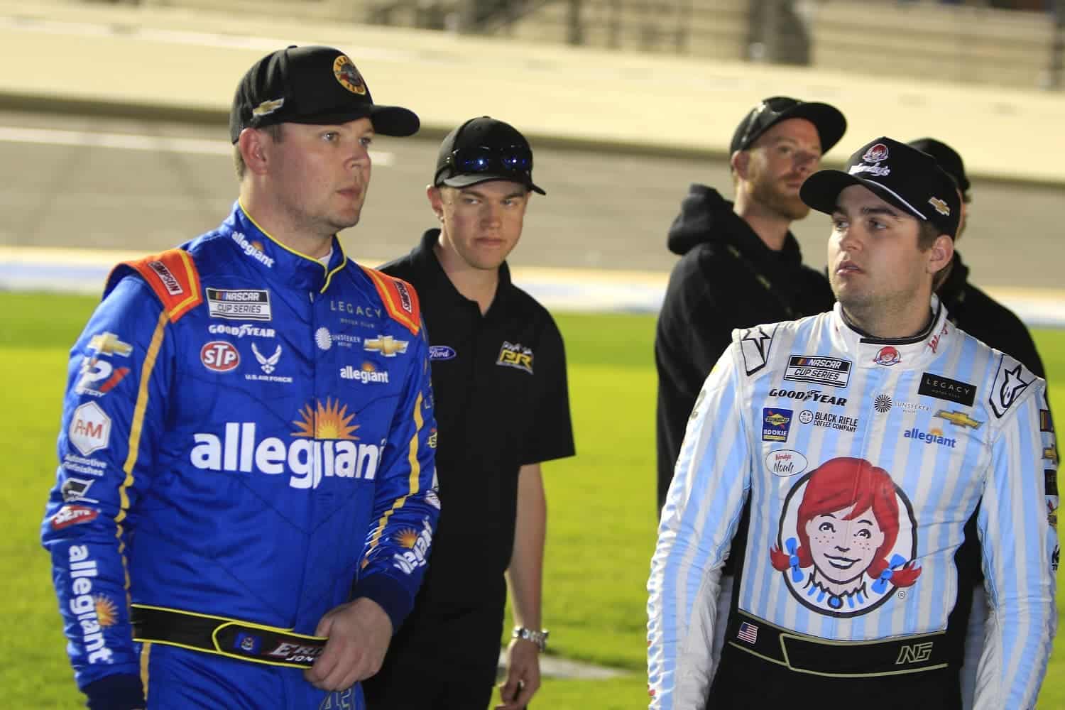 Erik Jones talks with Legacy Motor Club teammate Noah Gragson prior to the Bluegreen Vacations Duel 1 on Feb. 16, 2023 at Daytona International Speedway.