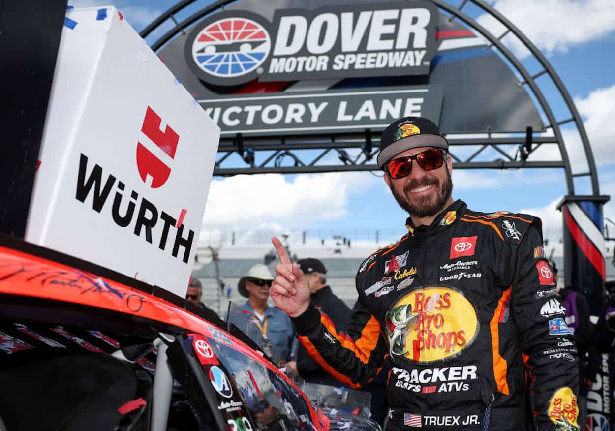 Martin Truex Jr. poses in Victory Lane at Dover.