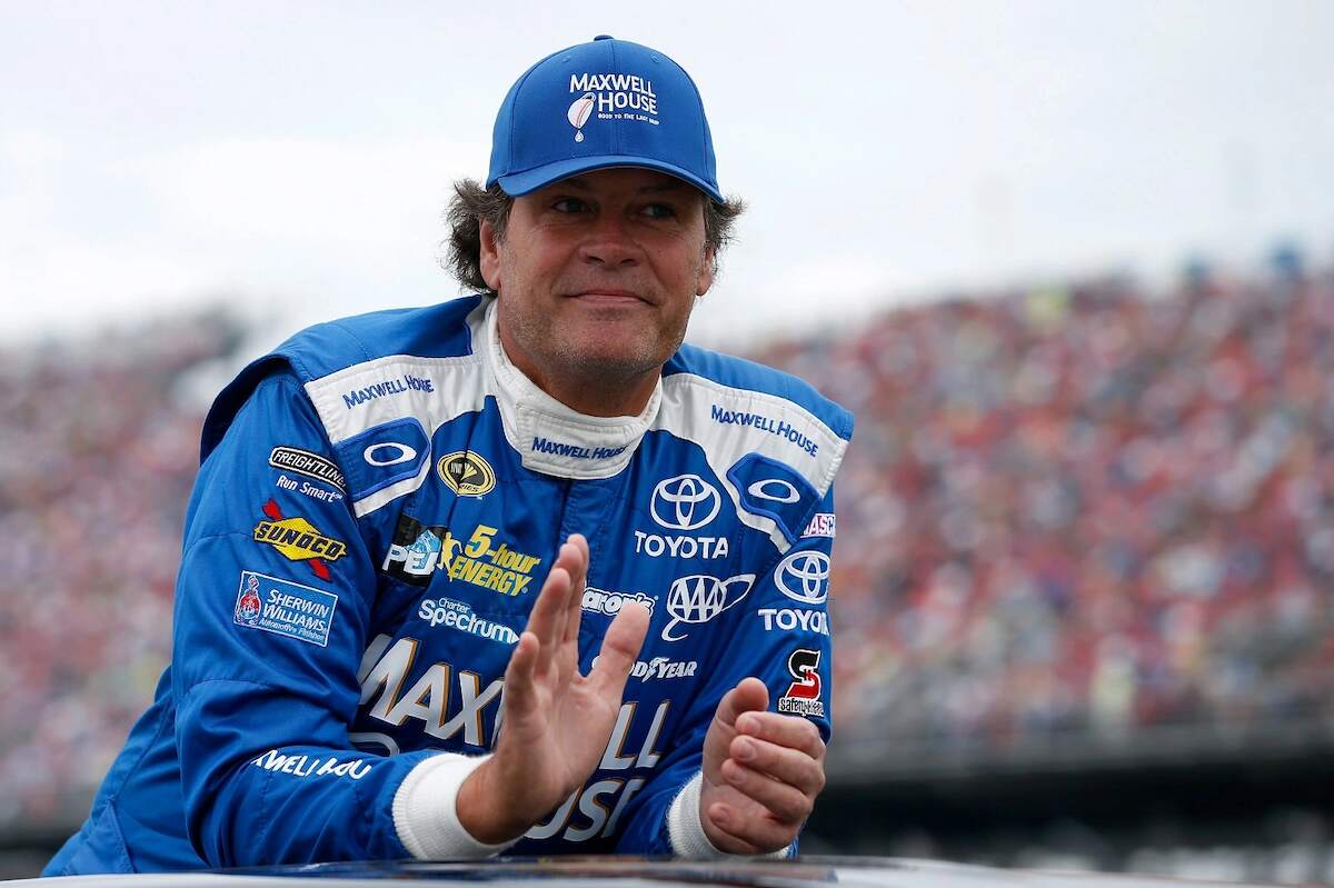 Michael Waltrip looks on during pre-race ceremonies at the NASCAR Sprint Cup Series CampingWorld.com 500 at Talladega Superspeedway on Oct. 25, 2015