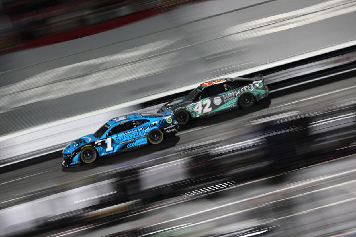 Noah Gragson (R) and Ross Chastain (L) battle on the race track.