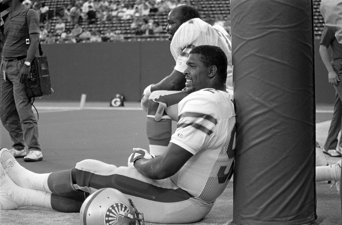 Reggie White leans against the goalpost with the Memphis Showboats