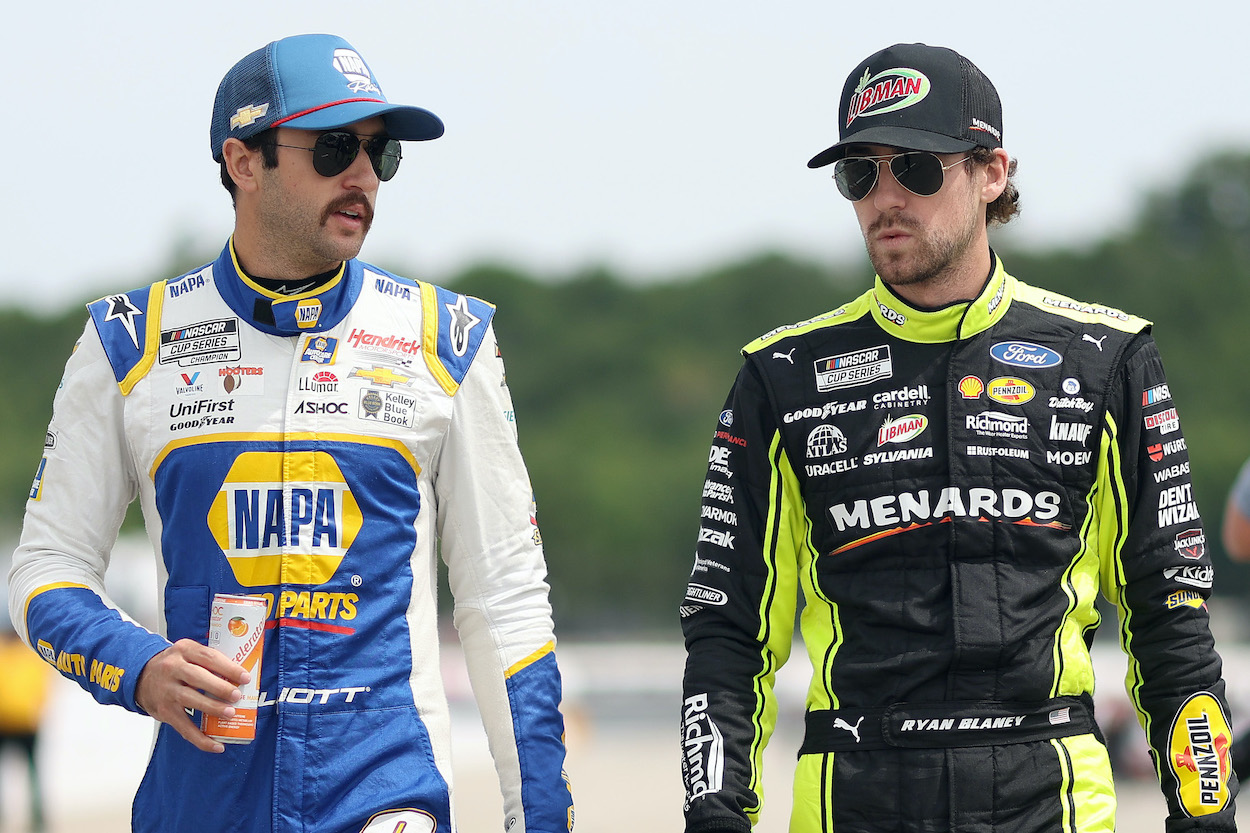 Chase Elliott and Ryan Blaney are talking. 
