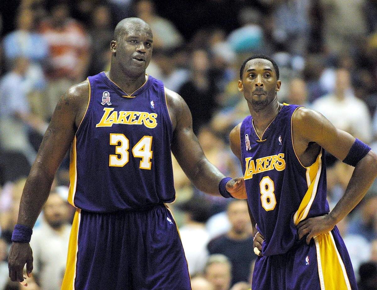 Lakers players Shaquille O'Neal and Kobe Bryant pause between plays to speak