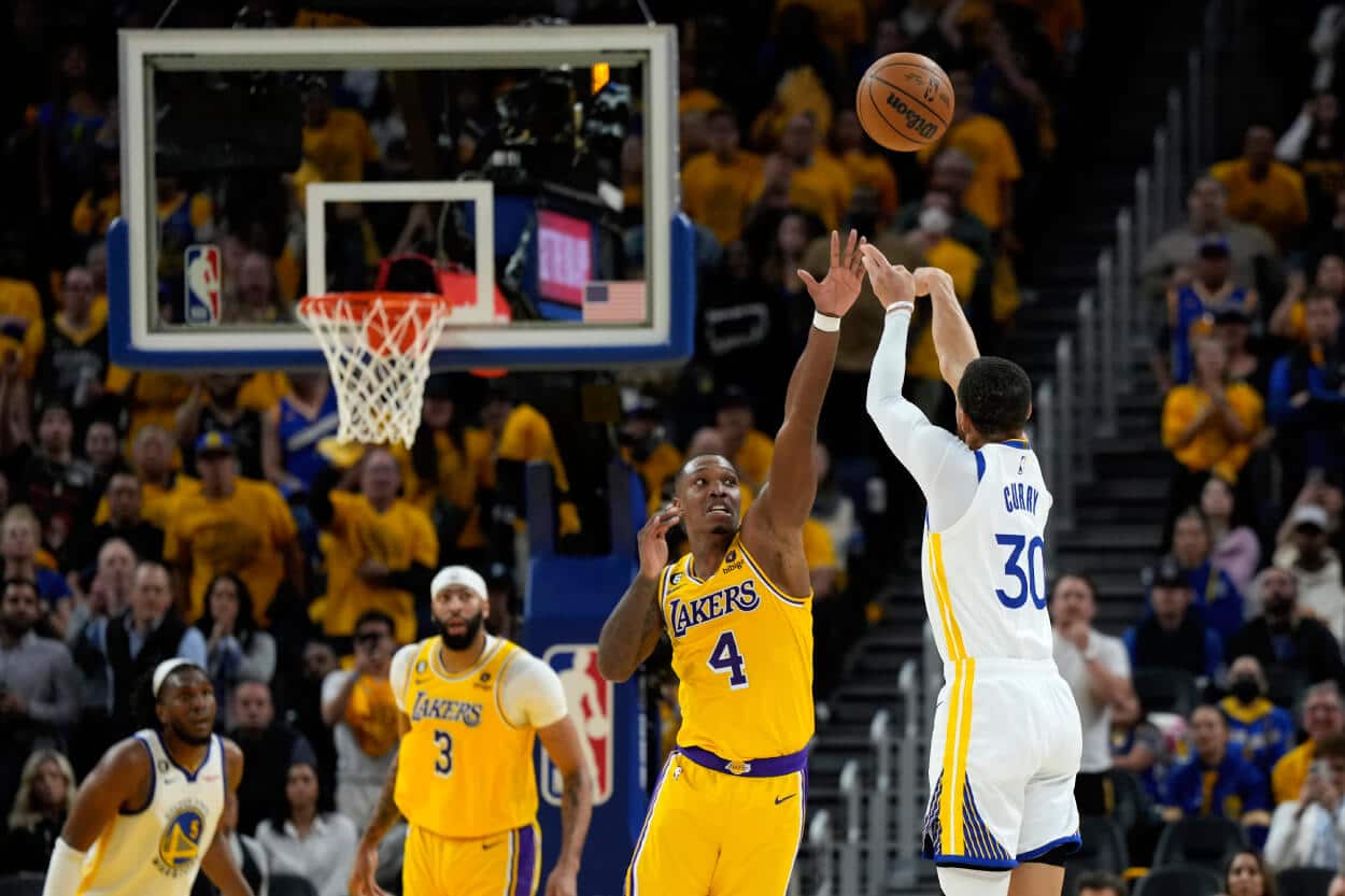 Stephen Curry of the Golden State Warriors shoots a three-point basket.