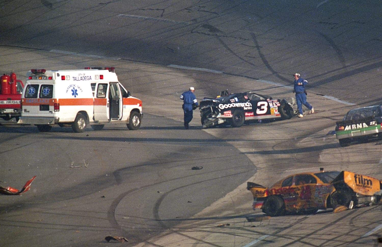 Emergency workers rush to the aid of Dale Earnhardt after a multi-car crash during the 1996 DieHard 500 at Talladega Superspeedway.  | ISC Images & Archives via Getty Images