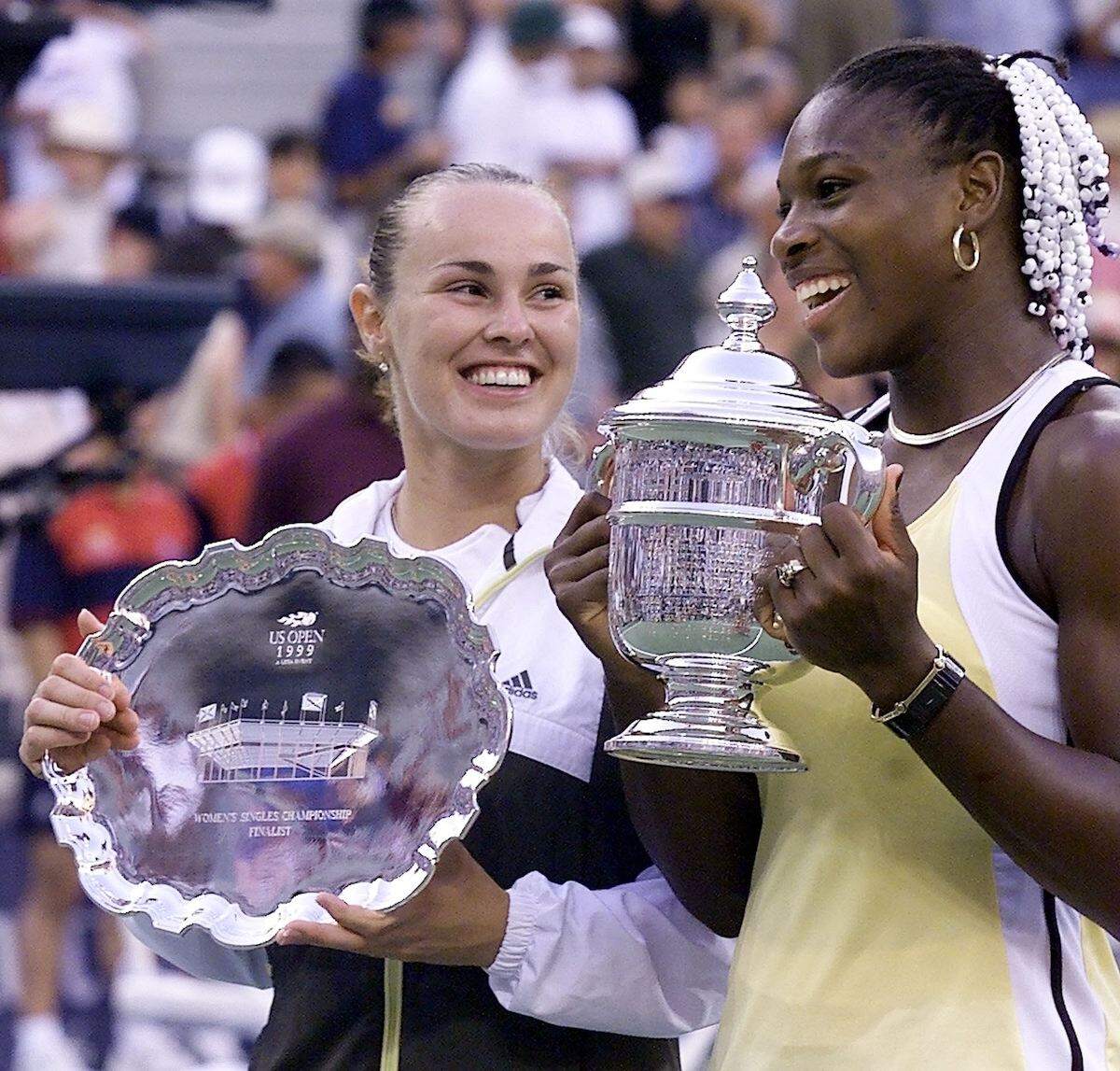 Serena Williams of the US holds the U.S. Open trophy after defeating Martina Hingis of Switzerland in 1999