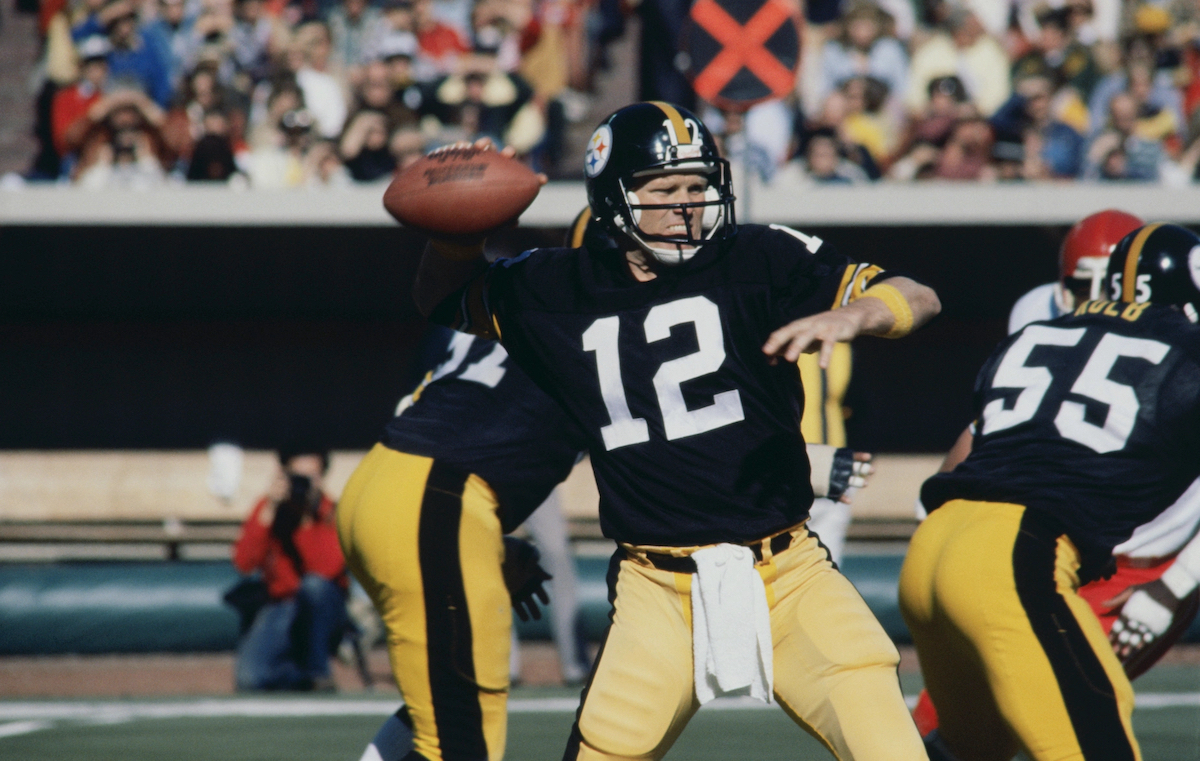Pittburgh Steelers quarterback Terry Bradshaw looks for a received as he holds the football