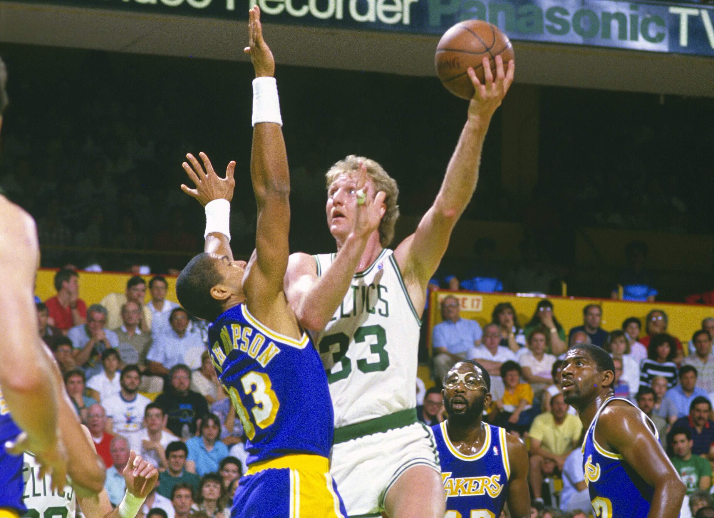 Larry Bird of the Boston Celtics shoots over Mychal Thompson of the Los Angeles Lakers.