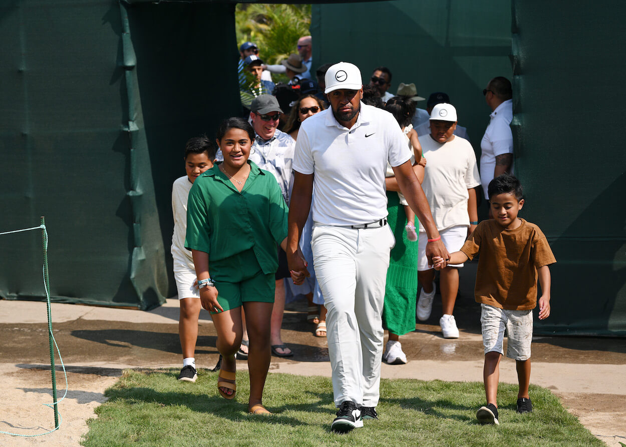 Tony Finau walks with his wife and children after winning the Mexico Open at Vidanta.