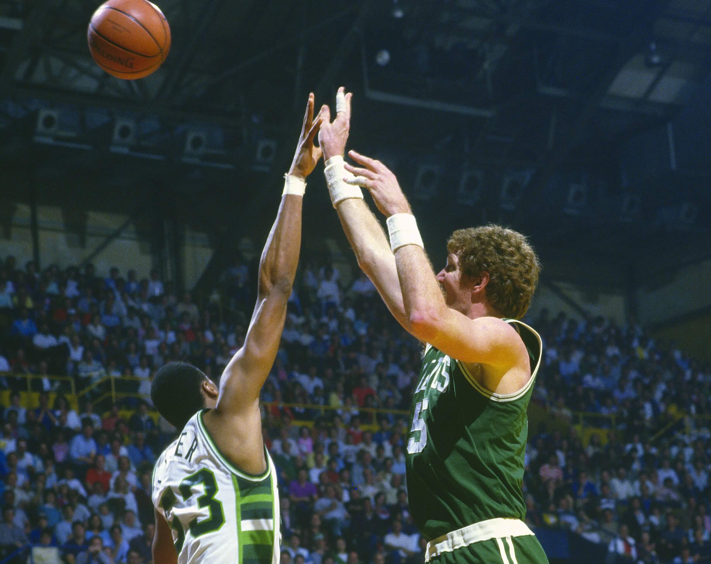 Bill Walton of the Boston Celtics shoots over Alton Lister of the Milwaukee Bucks.