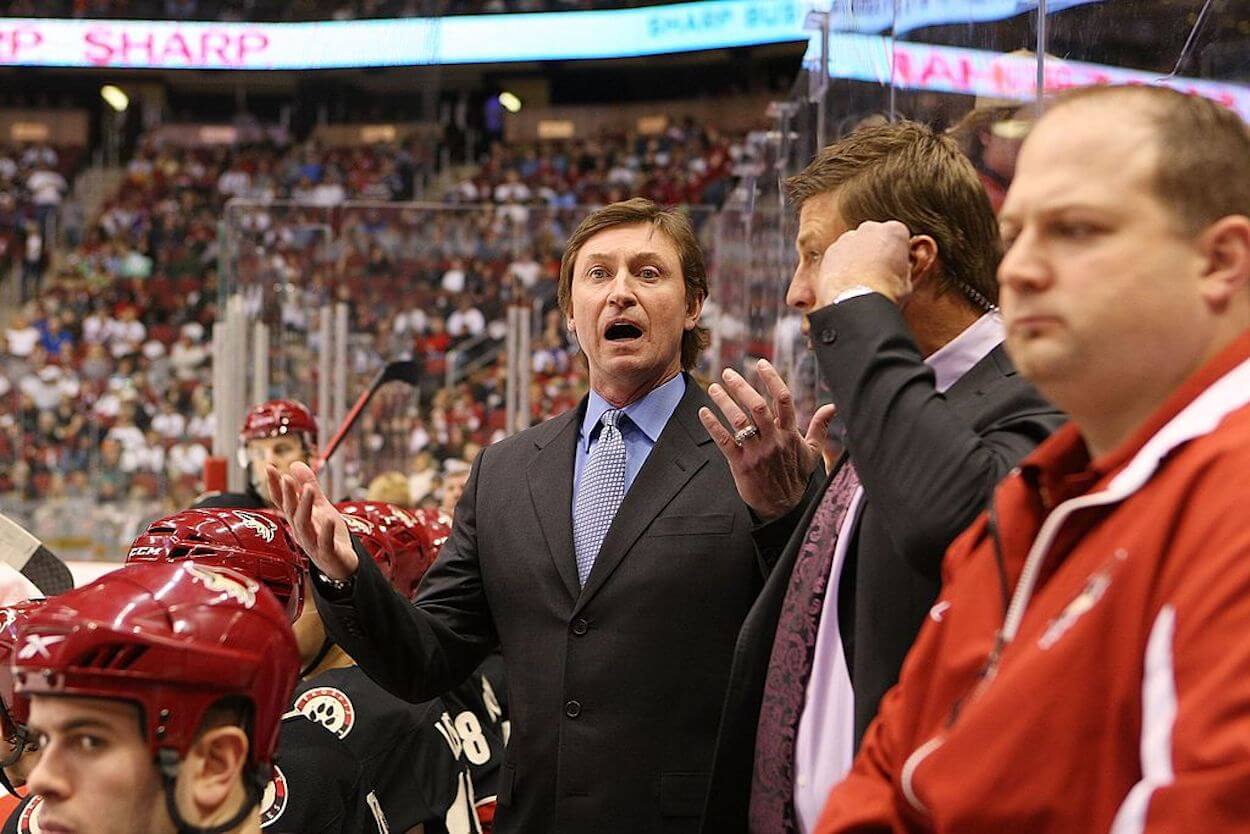Wayne Gretzky (L) coaching from the Phoenix Coyotes bench.