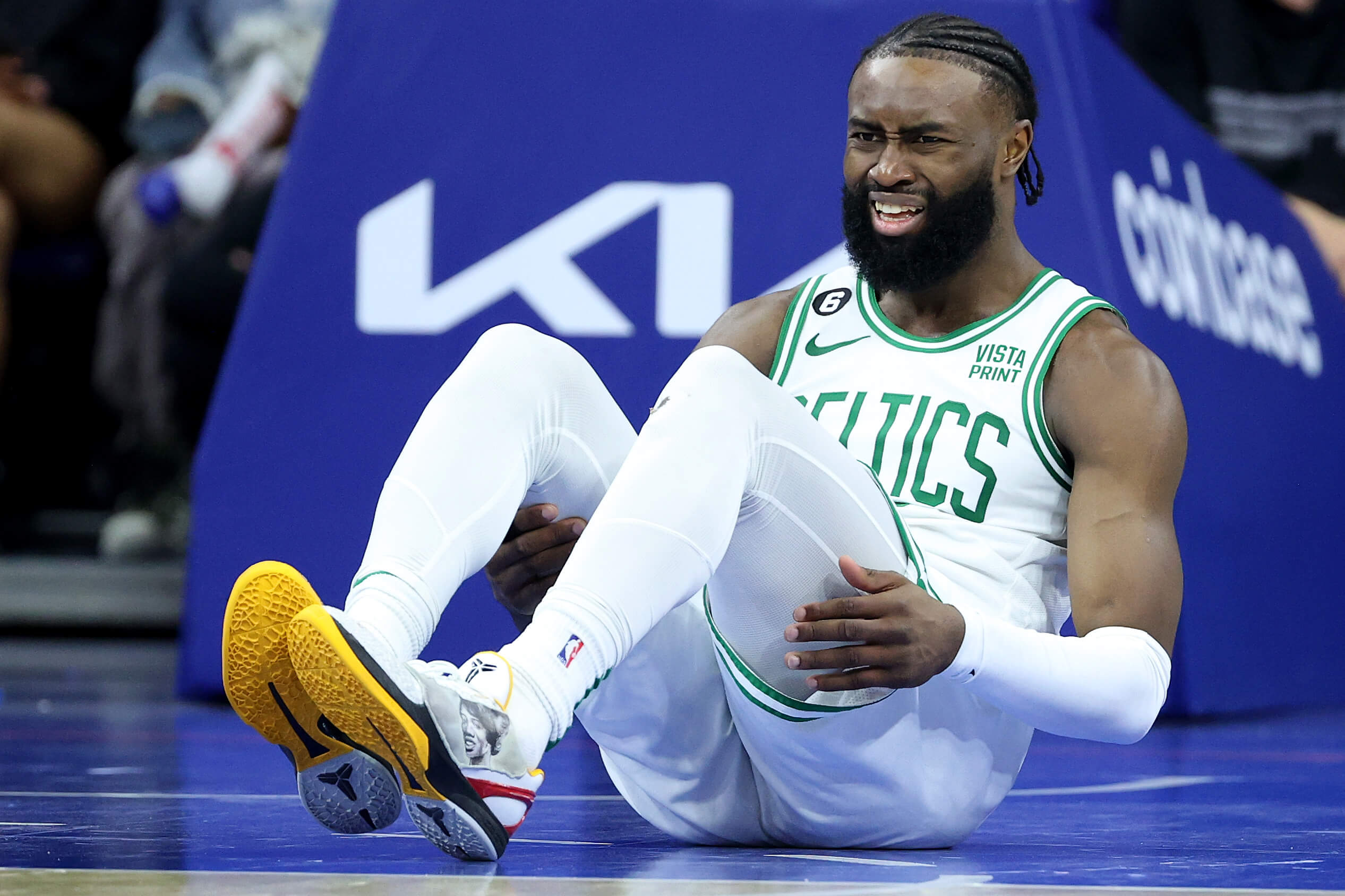 Jaylen Brown of the Boston Celtics winces in pain.