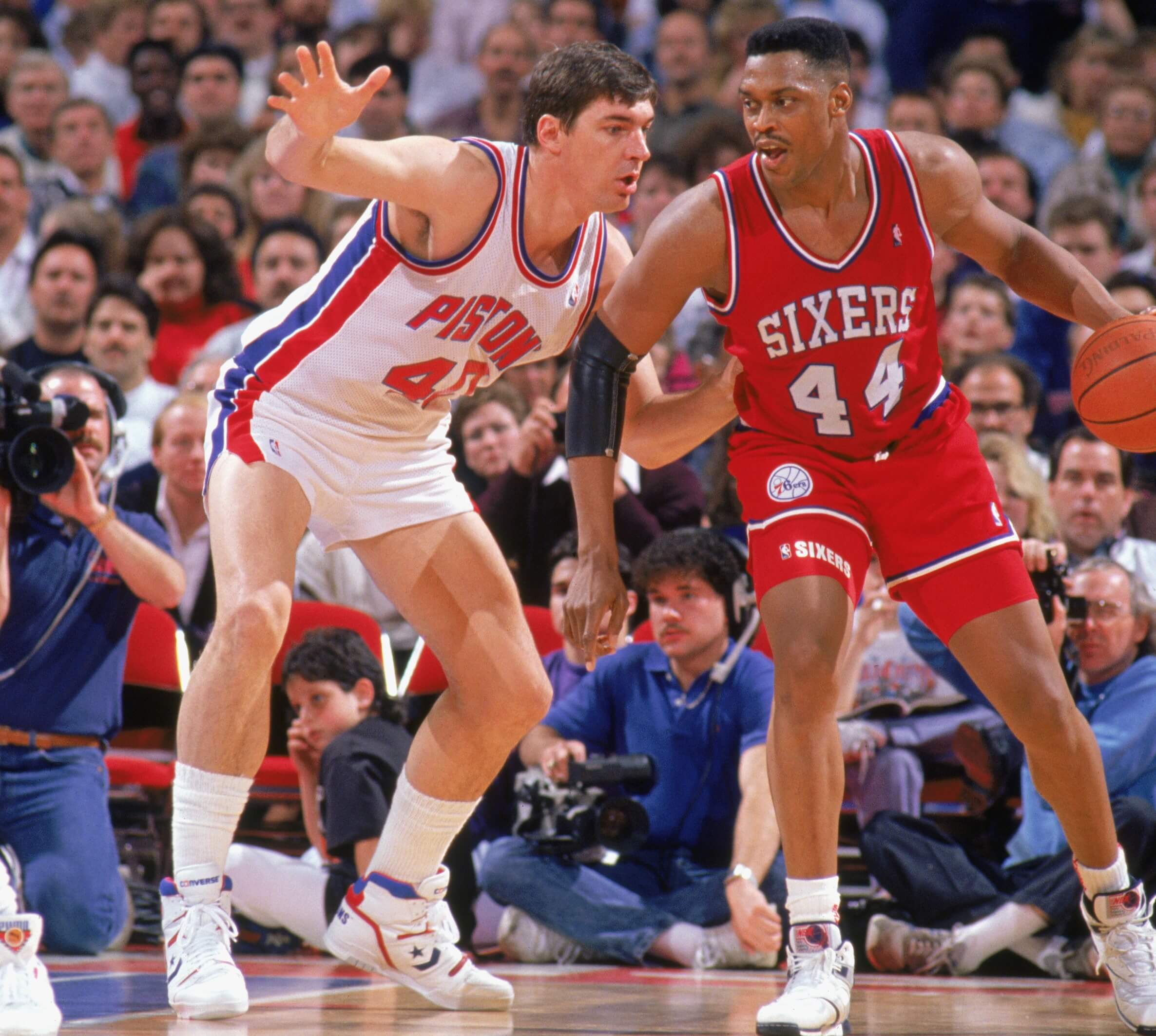 Rick Mahorn of the Philadelphia 76ers is defended by Bill Laimbeer of the Detroit Pistons.