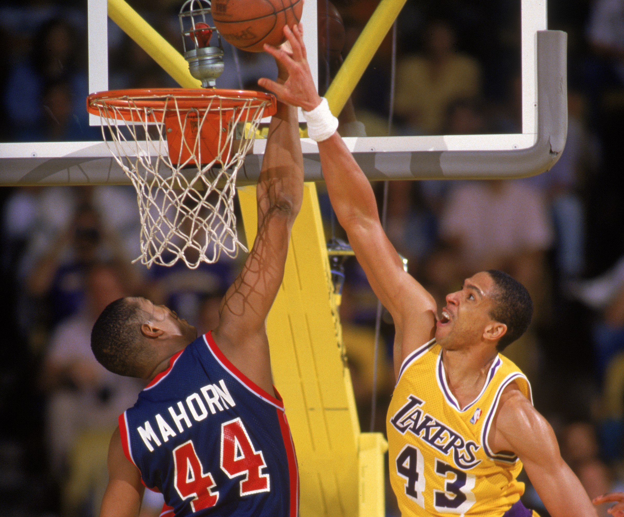 Mychal Thompson of the Los Angeles Lakers battles for a rebound with Rick Mahorn of the Detroit Pistons.