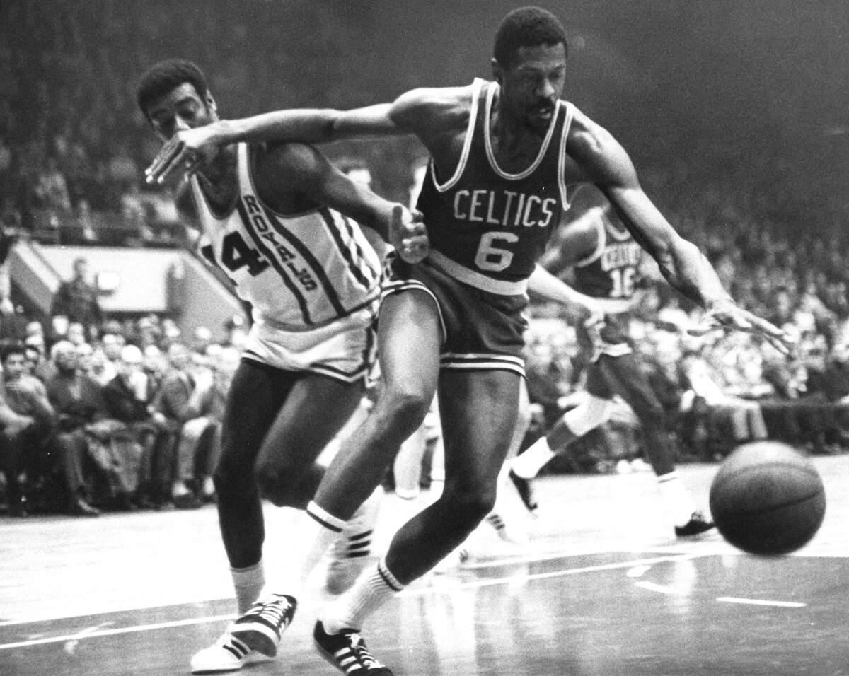 NBA players Bill Russell and Oscar Robertson in action