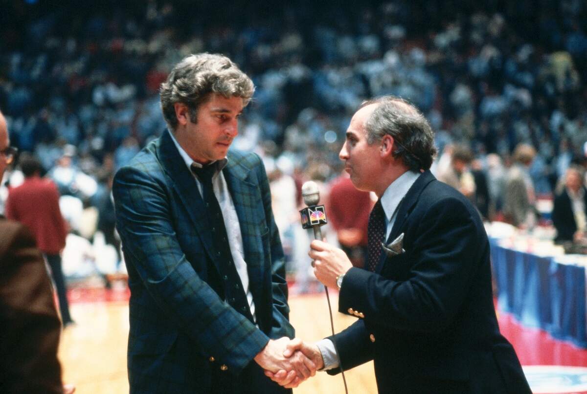 Sportscaster Billy Packer interviews coach Bobby Knight after Indiana's victory in the NCAA Final Four