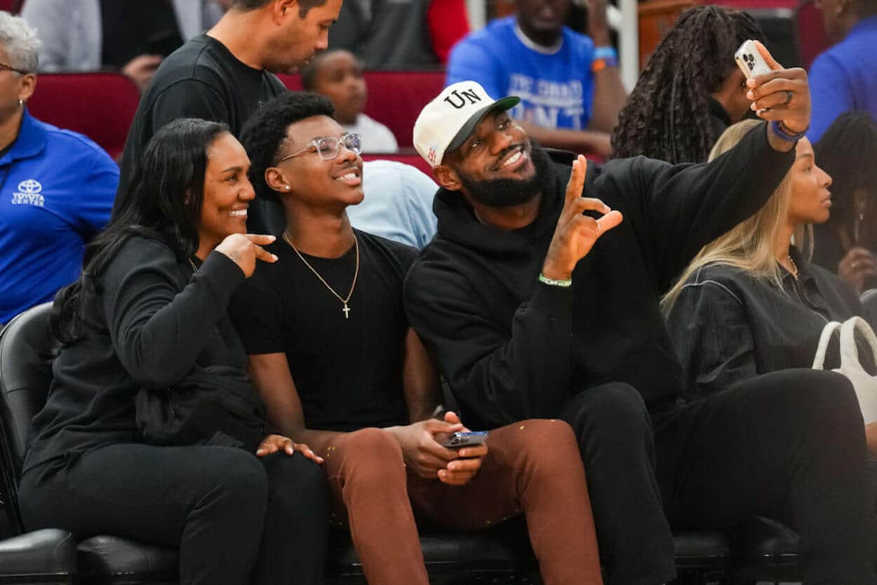 Bryce James (C) with his parents at the McDonald's All-American Game.