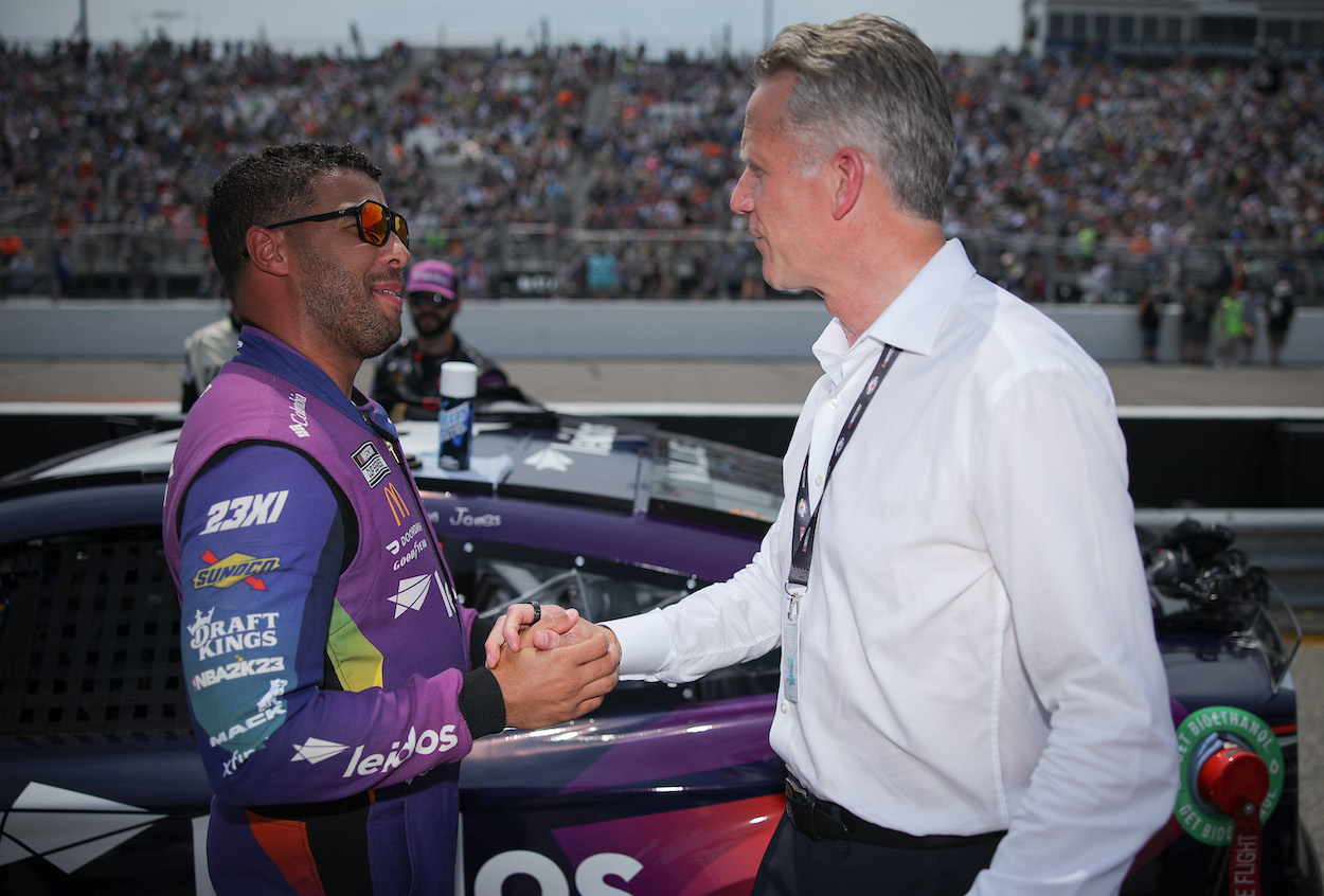 Bubba Wallace and Steve Phelps shake hands.