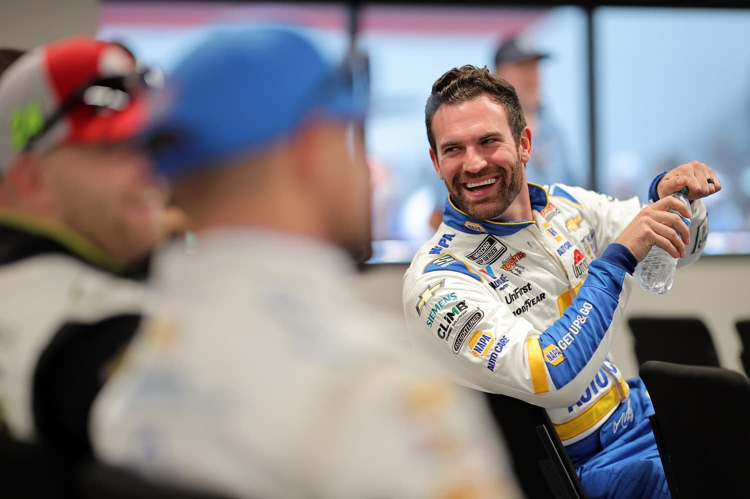 Corey LaJoie shares a laugh during the drivers meeting prior to the NASCAR Cup Series Enjoy Illinois 300 at WWT Raceway on June 4, 2023.