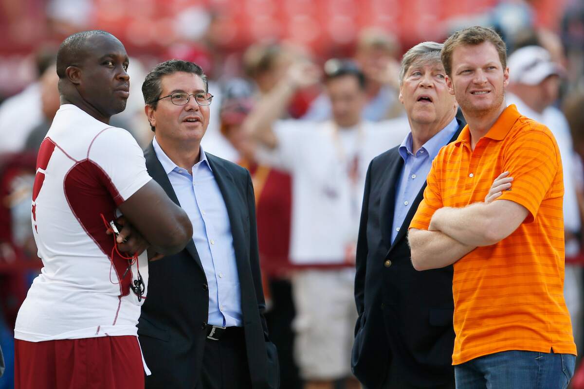 London Fletcher of the Washington Redskins talks with owner Daniel Snyder and NASCAR driver Dale Earnhardt Jr. before the start of a Washington game in 2012