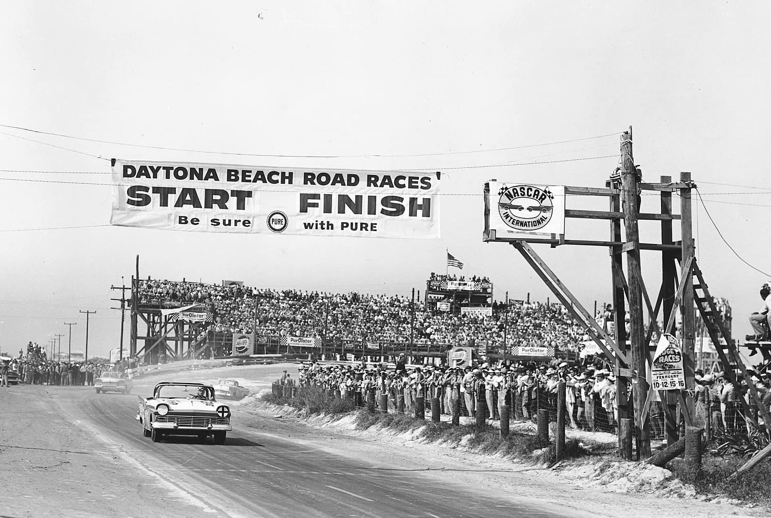 Although the Daytona Beach course was a temporary track built on the beach and a stretch of public highway, Bill France Sr. and NASCAR hosted many beach races, and all drew sizeable crowds. With the main grandstands as a backdrop, Curtis Turner's 1957 Ford convertible comes out of the North Turn, across the Start-Finish line and onto the paved stretch of Highway A1A, on Feb. 17, 1957.