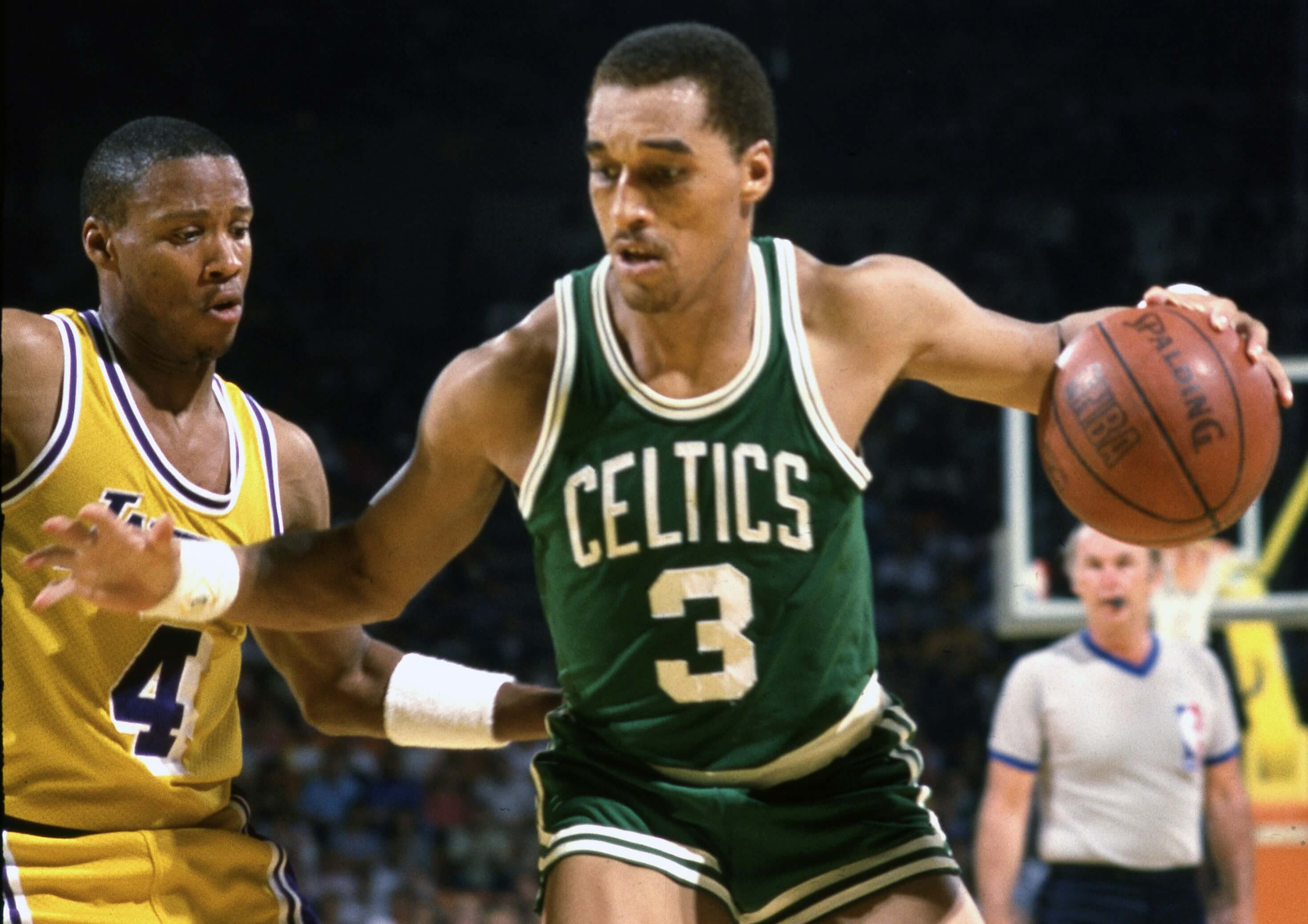 Boston Celtics guard Dennis Johnson drives toward the basket.