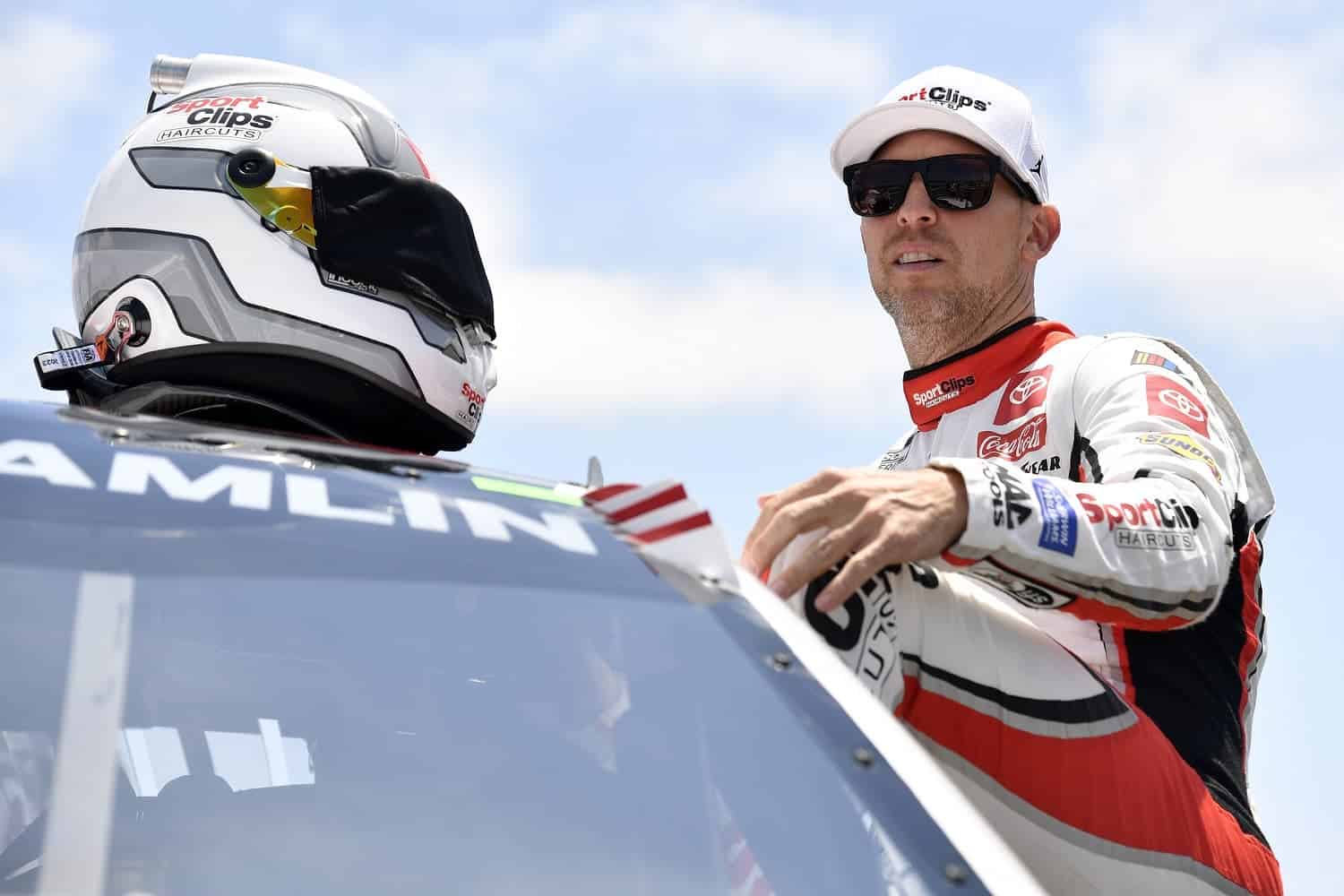 Denny Hamlin enters his car prior to the NASCAR Cup Series Toyota / Save Mart 350 at Sonoma Raceway on June 11, 2023.