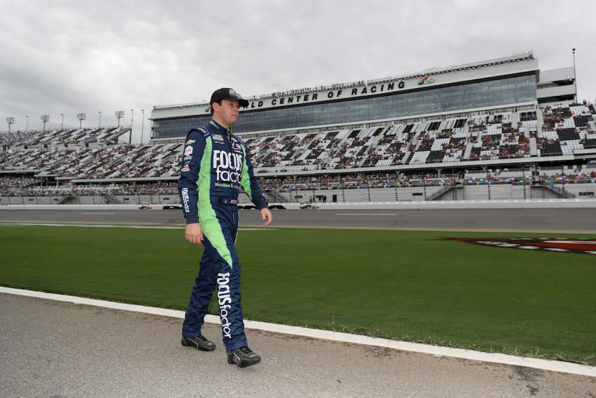 Erik Jones walks the grid prior to the NASCAR Cup Series Coke Zero Sugar 400