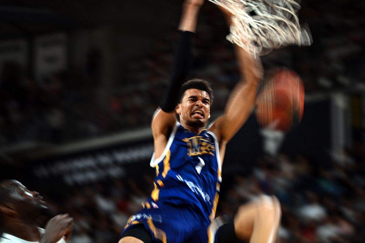 Metropolitan 92's French power forward Victor Wembanyama dunks the ball during a French Elite basketball playoff match in 2023