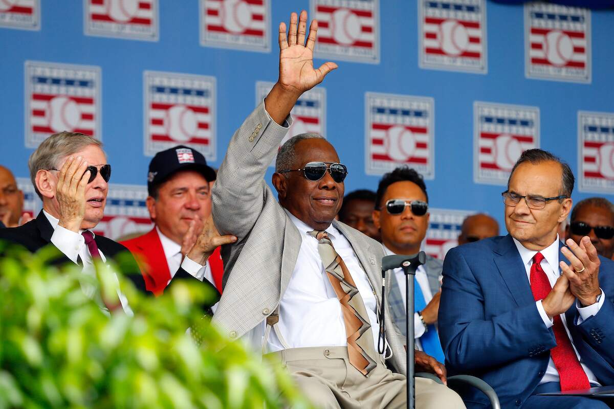 Hank Aaron waves at fans during his Hall of Fame ceremony