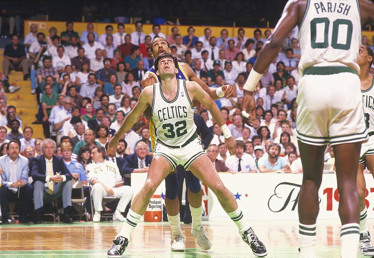 Kevin McHale boxes out for a rebound.