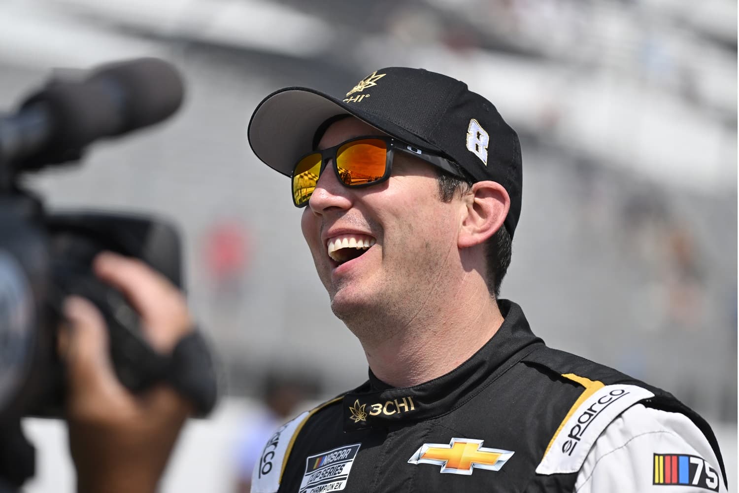 Kyle Busch laughs as he speaks to the media during qualifying for the NASCAR Cup Series Enjoy Illinois 300 at WWT Raceway on June 3, 2023.