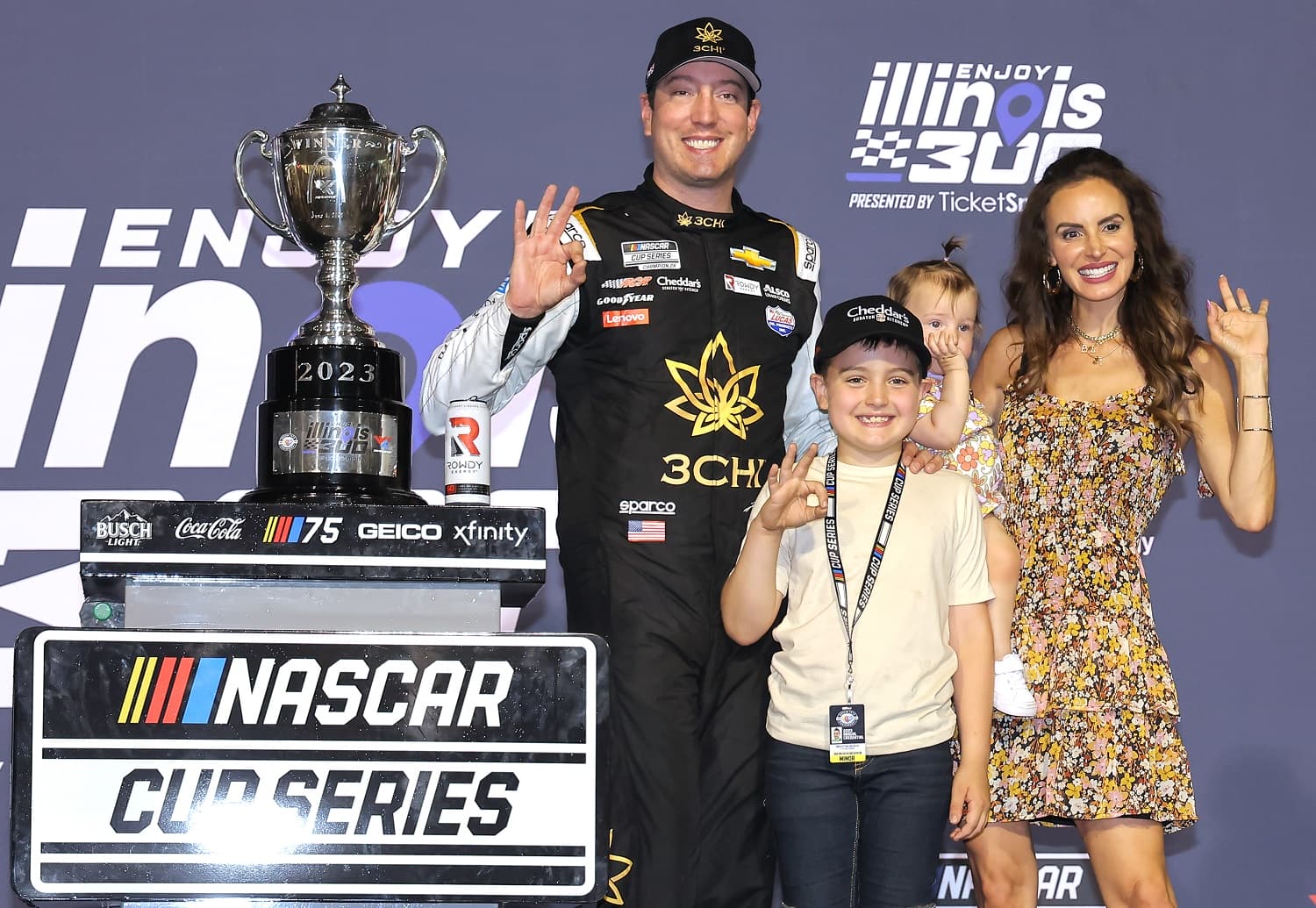 Kyle Busch celebrates with wife Samantha, son Brexton, and daughter Lennix after winning the NASCAR Cup Series Enjoy Illinois 300 at WWT Raceway on June 4, 2023.