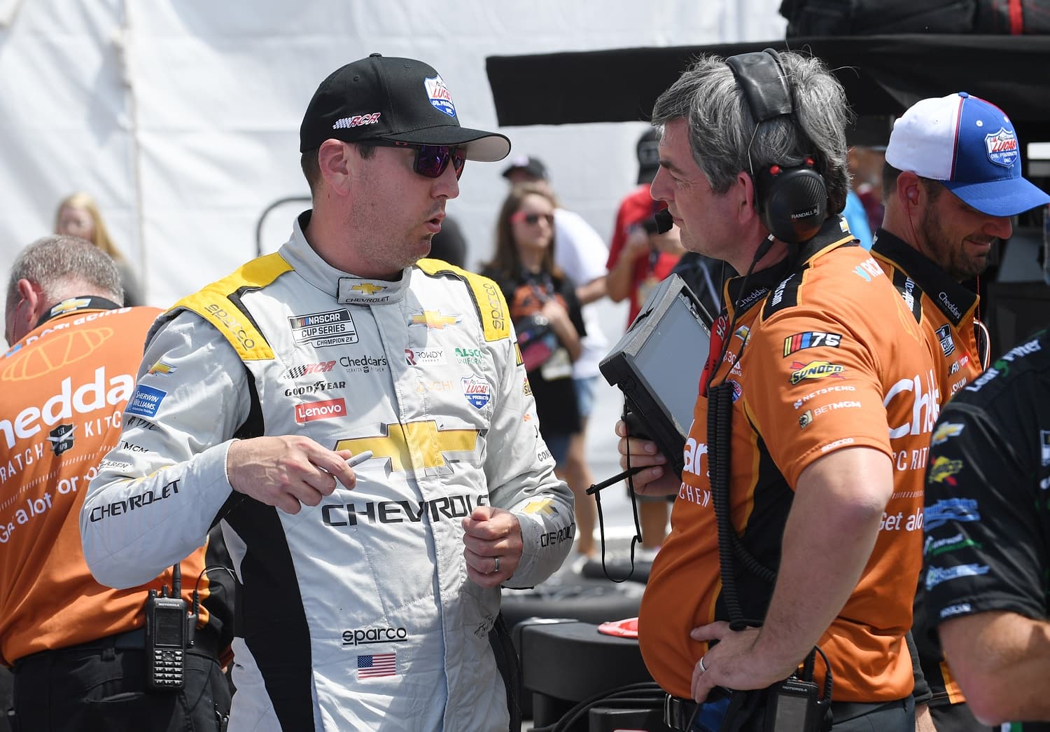 Kyle Busch talks to crew chief Randall Burnett during qualifying for the NASCAR Cup Series Goodyear 400 on May 13, 2023, at Darlington Raceway.