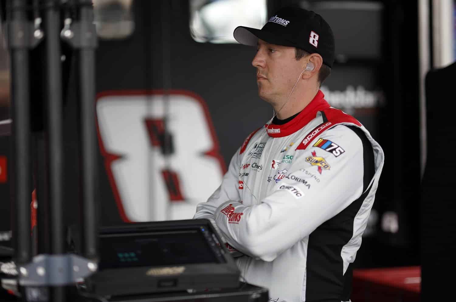 Kyle Busch looks on in the garage area during practice for the NASCAR Cup Series All-Star Race at North Wilkesboro Speedway.