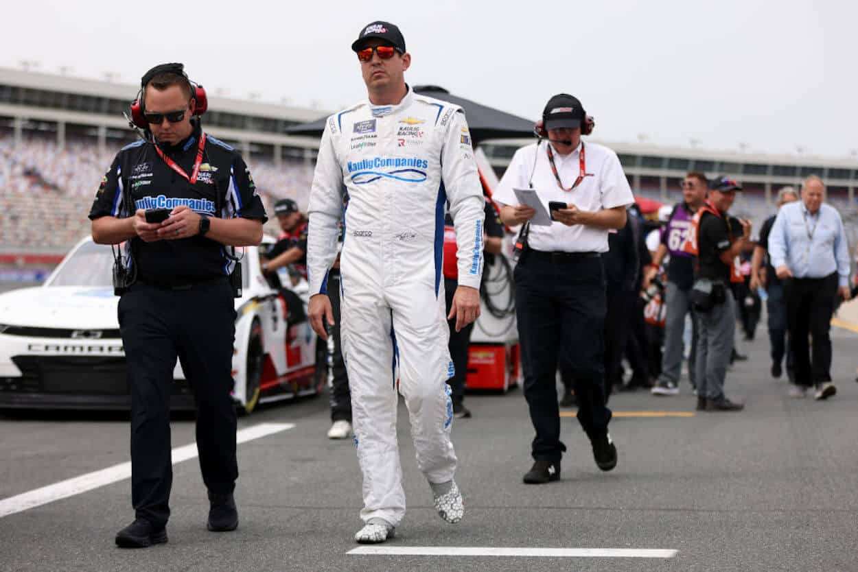 Kyle Busch walks the grid at Charlotte.