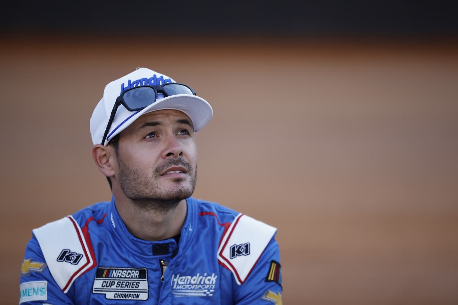 Kyle Larson waits on the grid prior to the NASCAR Cup Series Food City Dirt Race at Bristol Motor Speedway on April 9, 2023, in Bristol, Tennessee.