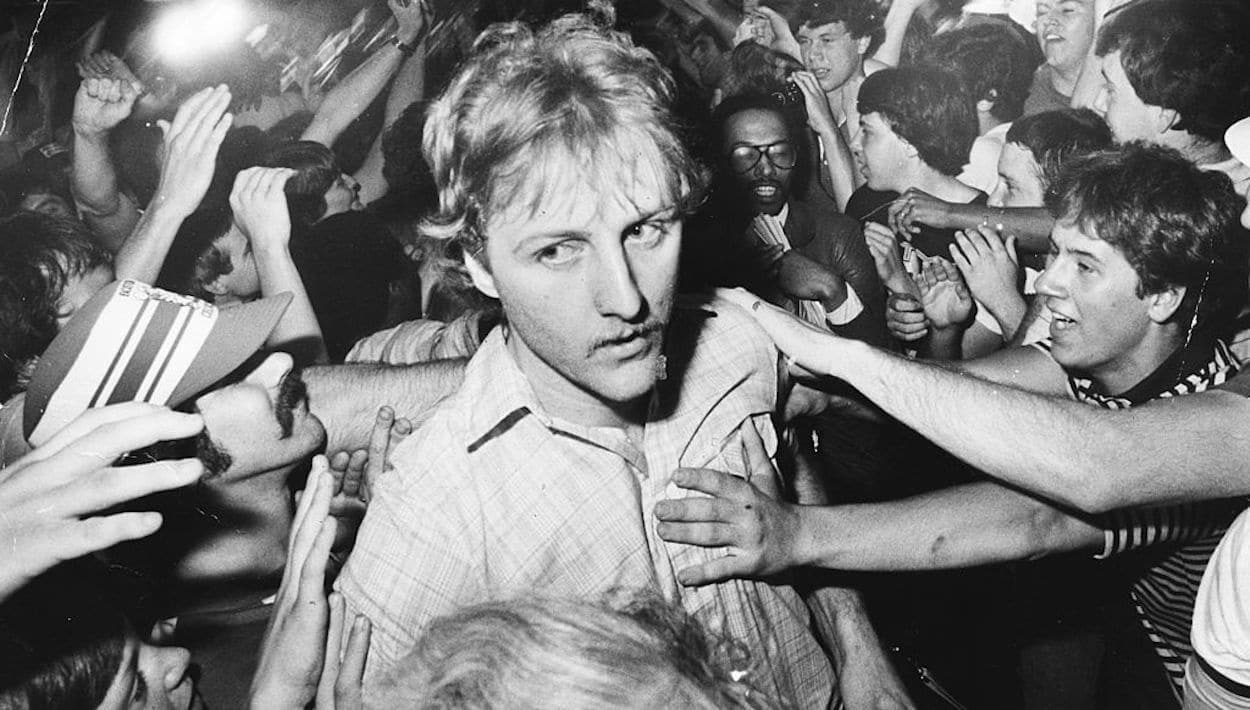 Celtics fans surround Larry Bird in 1981.