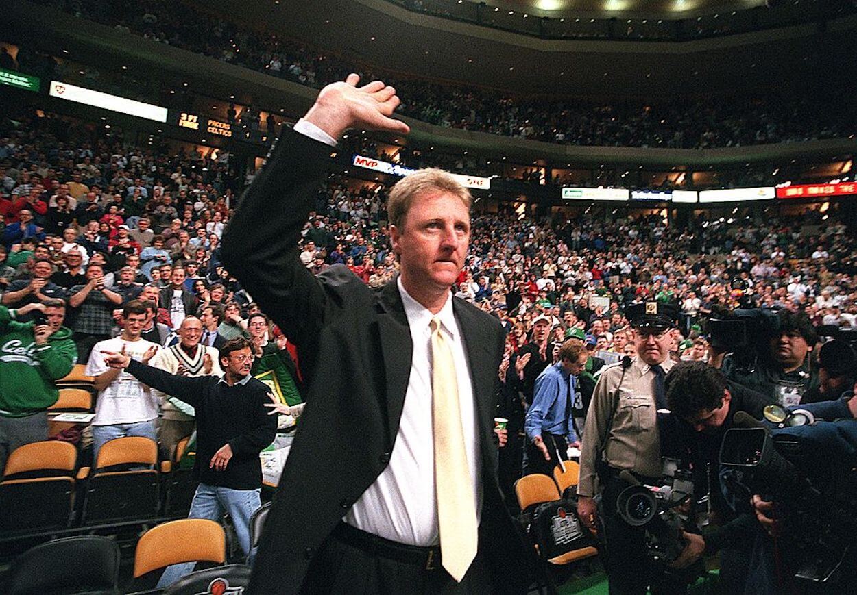 Larry Bird acknowledges the Boston crowd while coaching the Pacers.